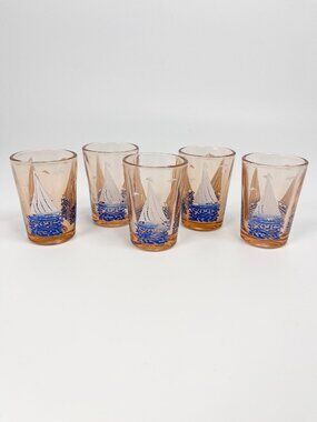 Vintage mini peach coloured shot glasses with sailboat motif